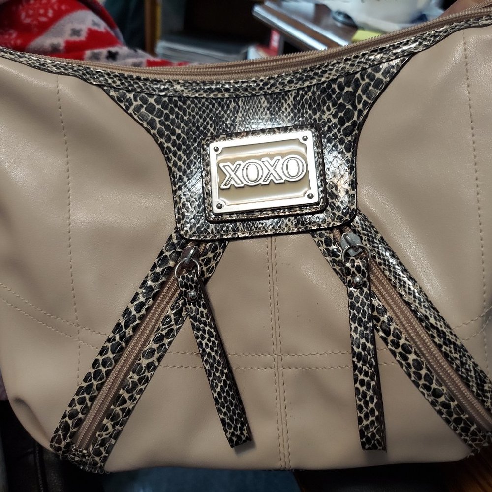 XOXO purse approximately   12x9   Mainly tan